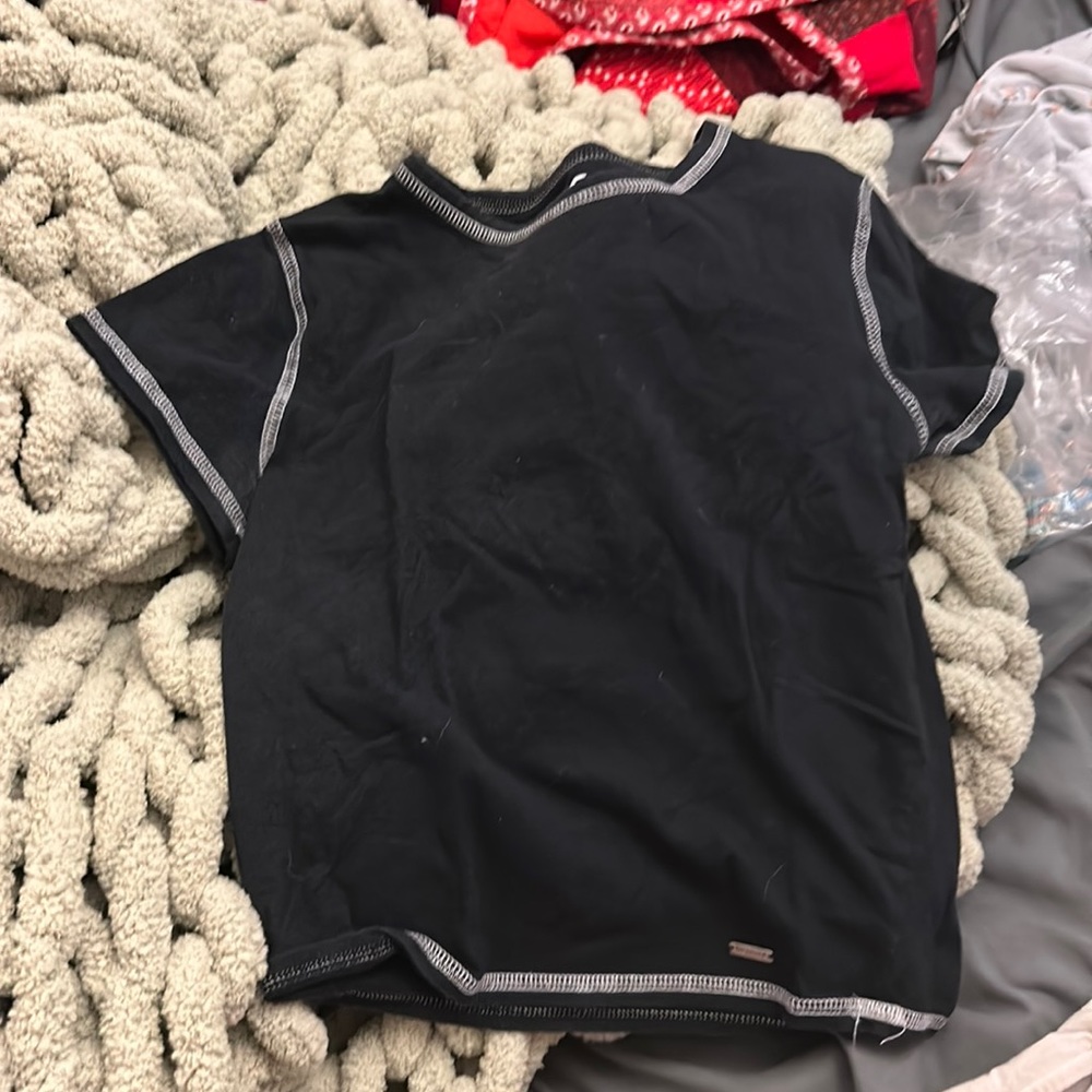 black baby tee with white stitching